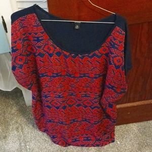 Red and navy colored blouse